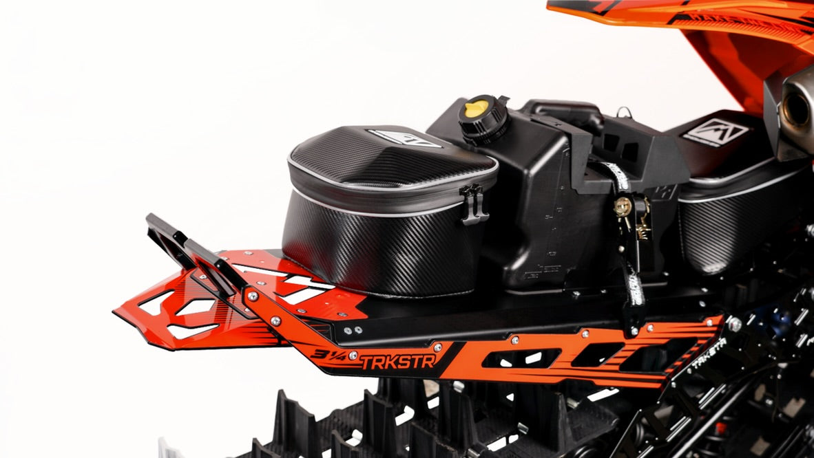 MTN.TOP Tunnel Bag mounted on a TRKSTR snowbike tunnel behind an auxiliary gas jug
