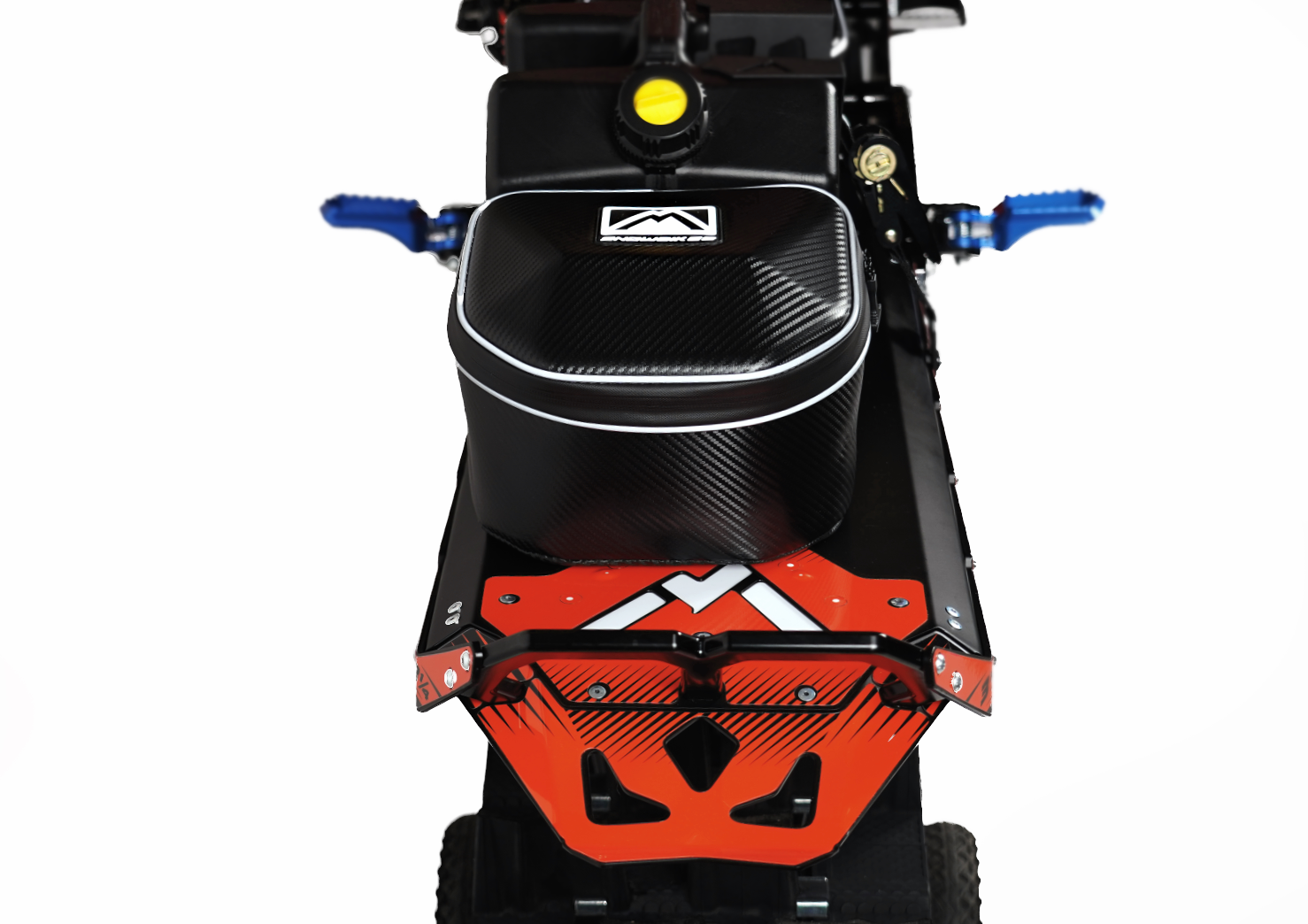 MTN.TOP Tunnel Bag mounted on a snowbike tunnel behind an auxiliary gas jug, offset to the left