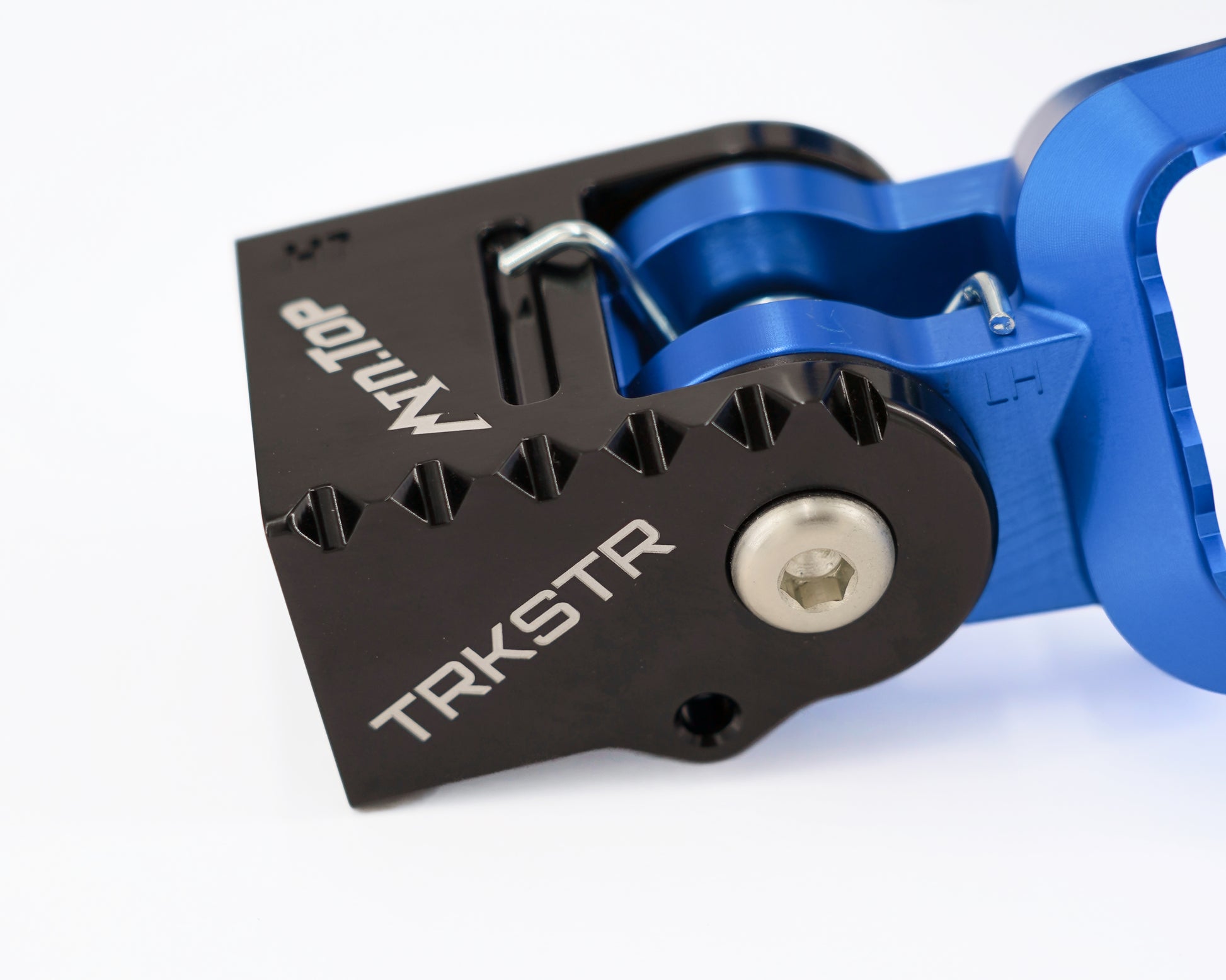 Close-up of a rear tunnel peg with a black anodized aluminum front plate and a bright blue anodized aluminum body, featuring white printed branding.