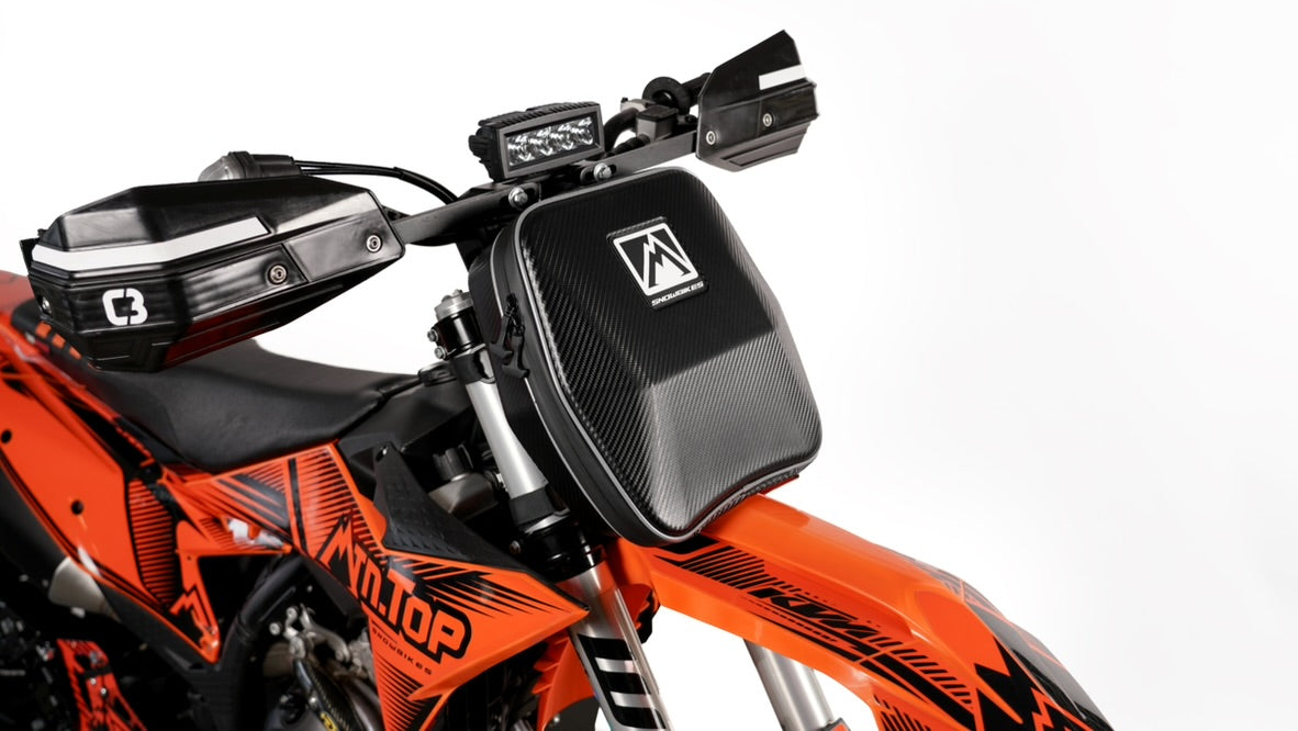 MTN.TOP Number Plate Bag mounted on the front of a snowbike