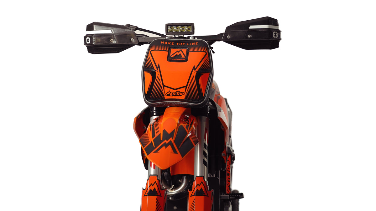 Front view of MTN.TOP Number Plate Bag with orange graphic kit and handlebar LED light bar